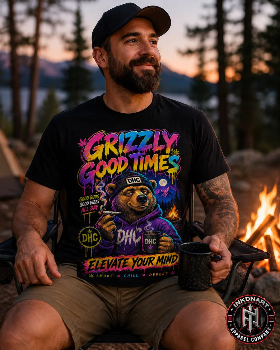 Grizzly Good Times psychedelic bear graphic tee worn by model by a campfire – INKDnART featured picks