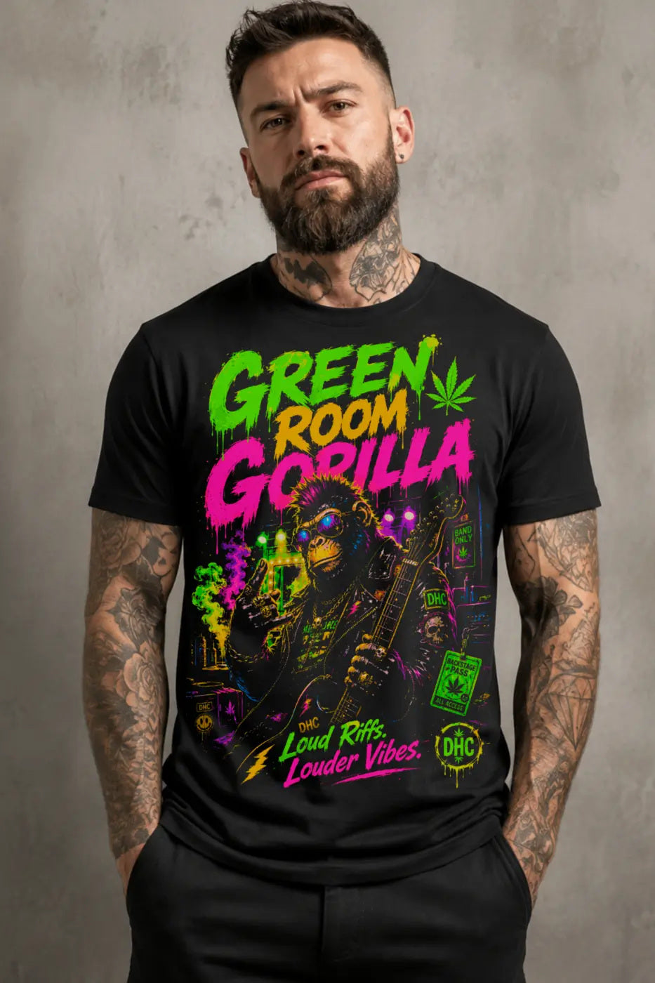 Green Room Gorilla Tee – blacklight neon gorilla graphic tee, worn by tattooed model on gray background