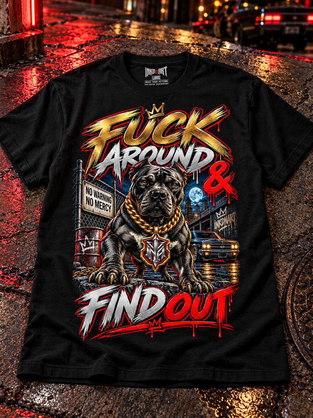 Black Fuck Around & Find Out Pitbull tee laid front-up on dark concrete with subtle urban red light, with the INKDnART interior neck tag.