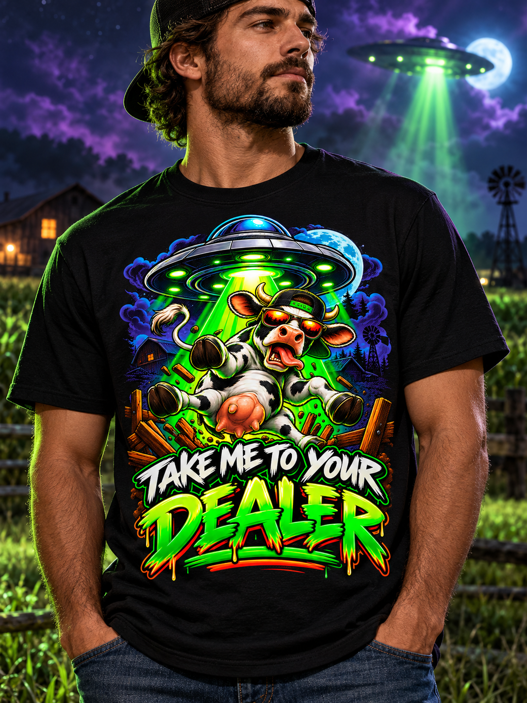 Close front view of the black Take Me to Your Dealer UFO Cow T-shirt showing the complete colorful graphic and crewneck.